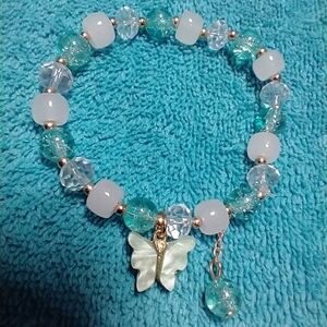 Goldtone Aqua green cracked glass white butterfly stretch beaded bracelet